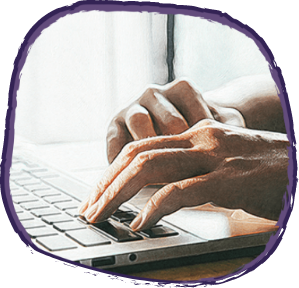 A person typing on a laptop